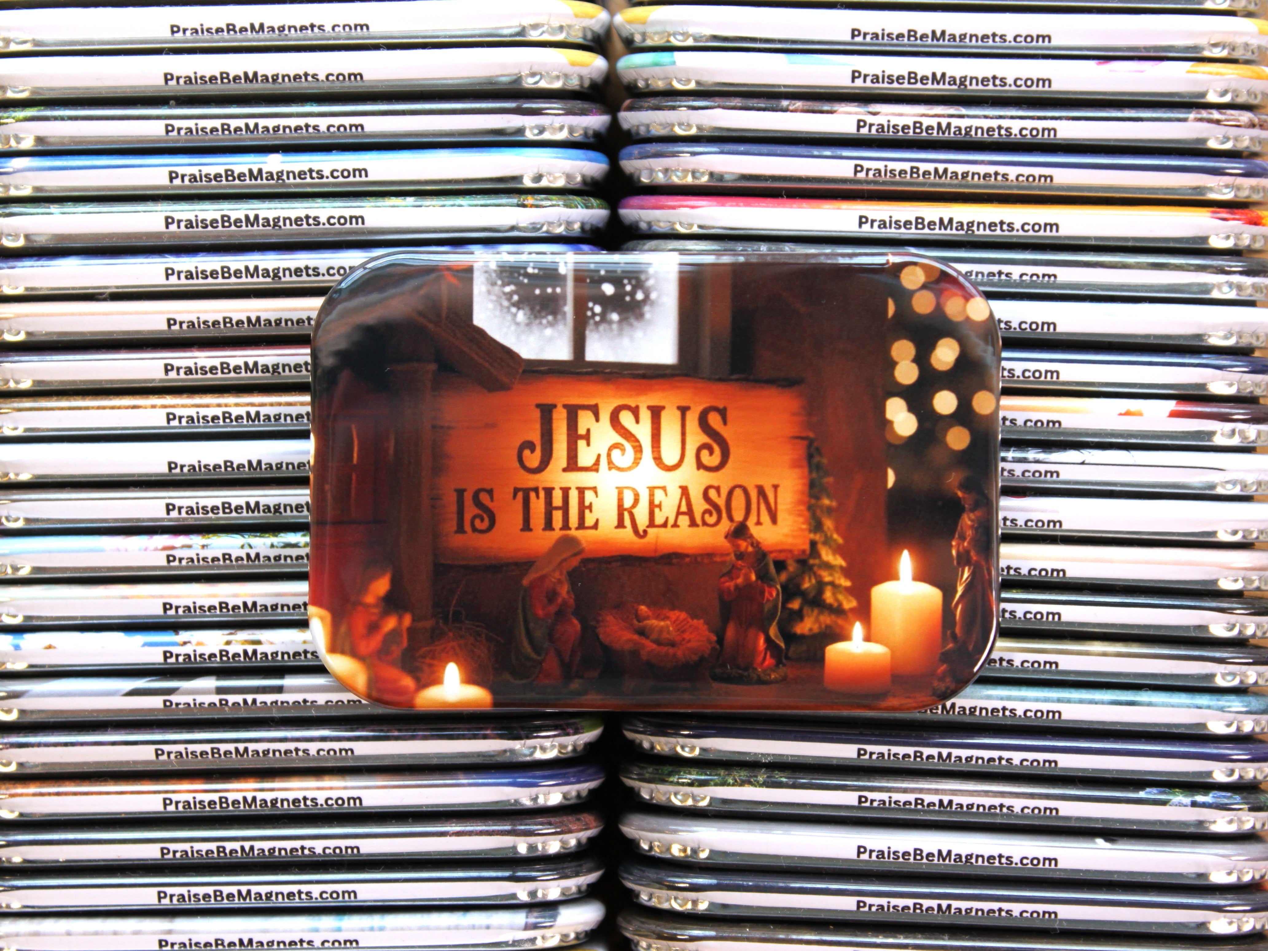 Stack of 'Jesus is the Reason' magnets with a prominent magnet in the foreground.