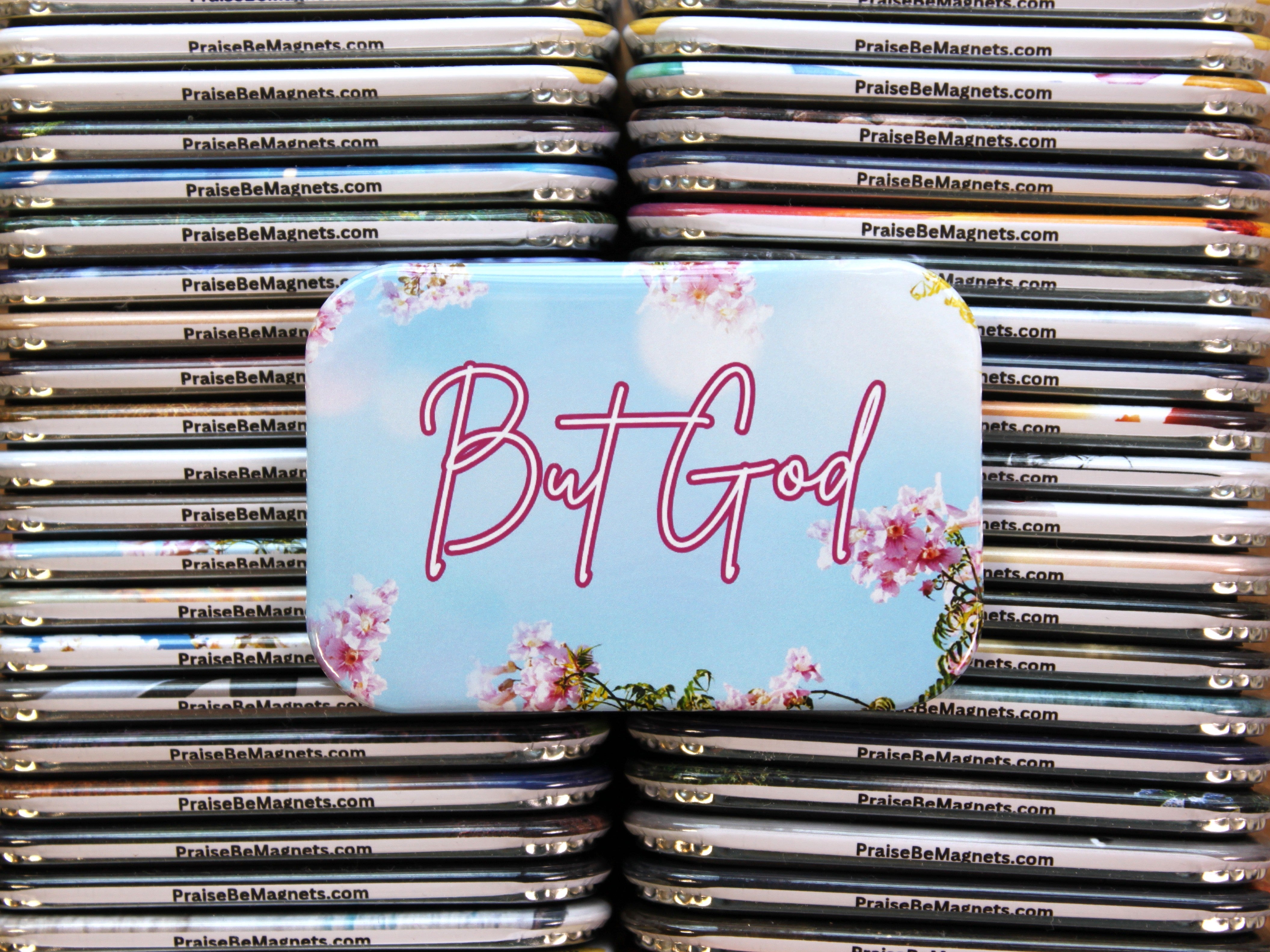 Stack of 'PraiseBeMagnets' with a prominent 'But God' magnet on top