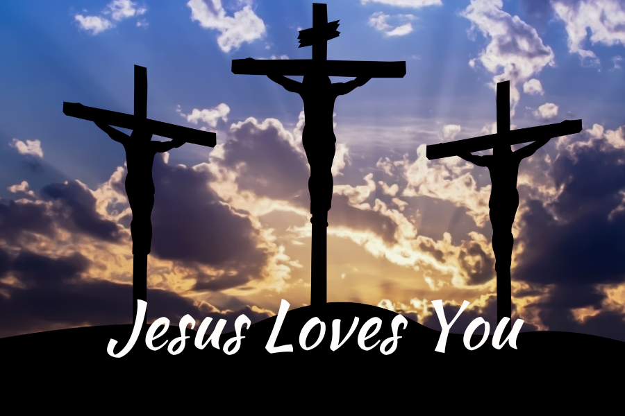 Silhouette of three crucifixes against a sunset sky with 'Jesus Loves You' text.