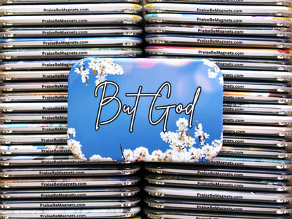 Stack of 'PraiseBeMagnets' with a prominent magnet featuring 'But God' text and floral design.