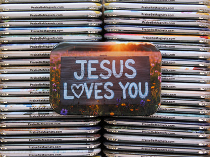 Stack of metal magnets with 'Jesus Loves You' text on a single magnet