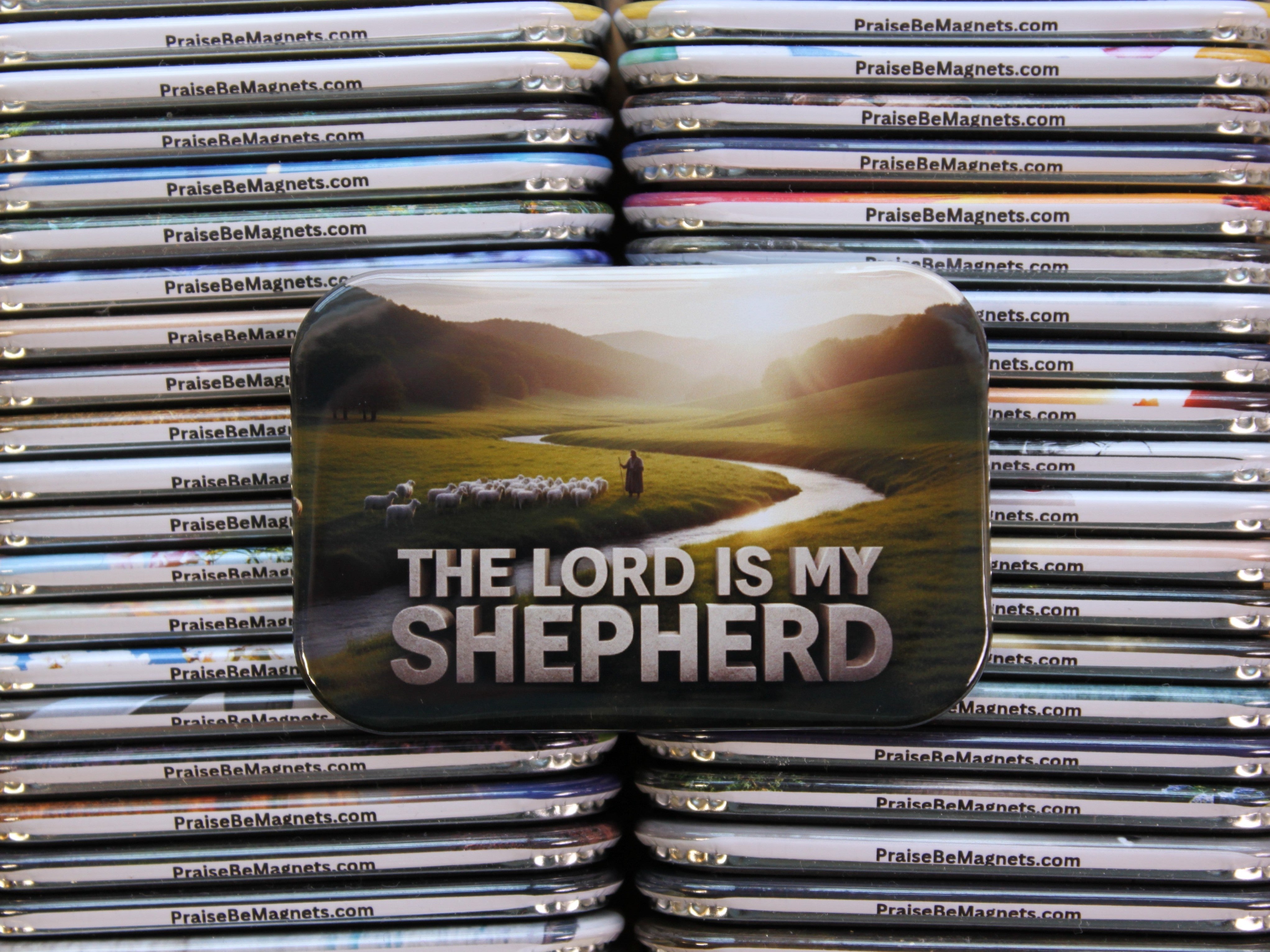 Stack of metal magnets with 'The Lord is My Shepherd' design on top
