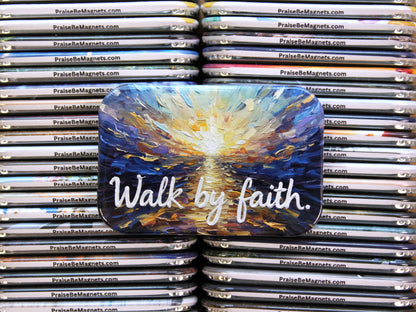 Stack of 'Praise Be' magnets with a prominent magnet featuring 'Walk by faith.'
