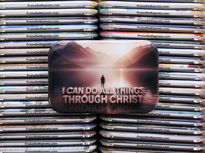 Stack of metal magnets with a central magnet featuring a motivational quote and a mountain scene.