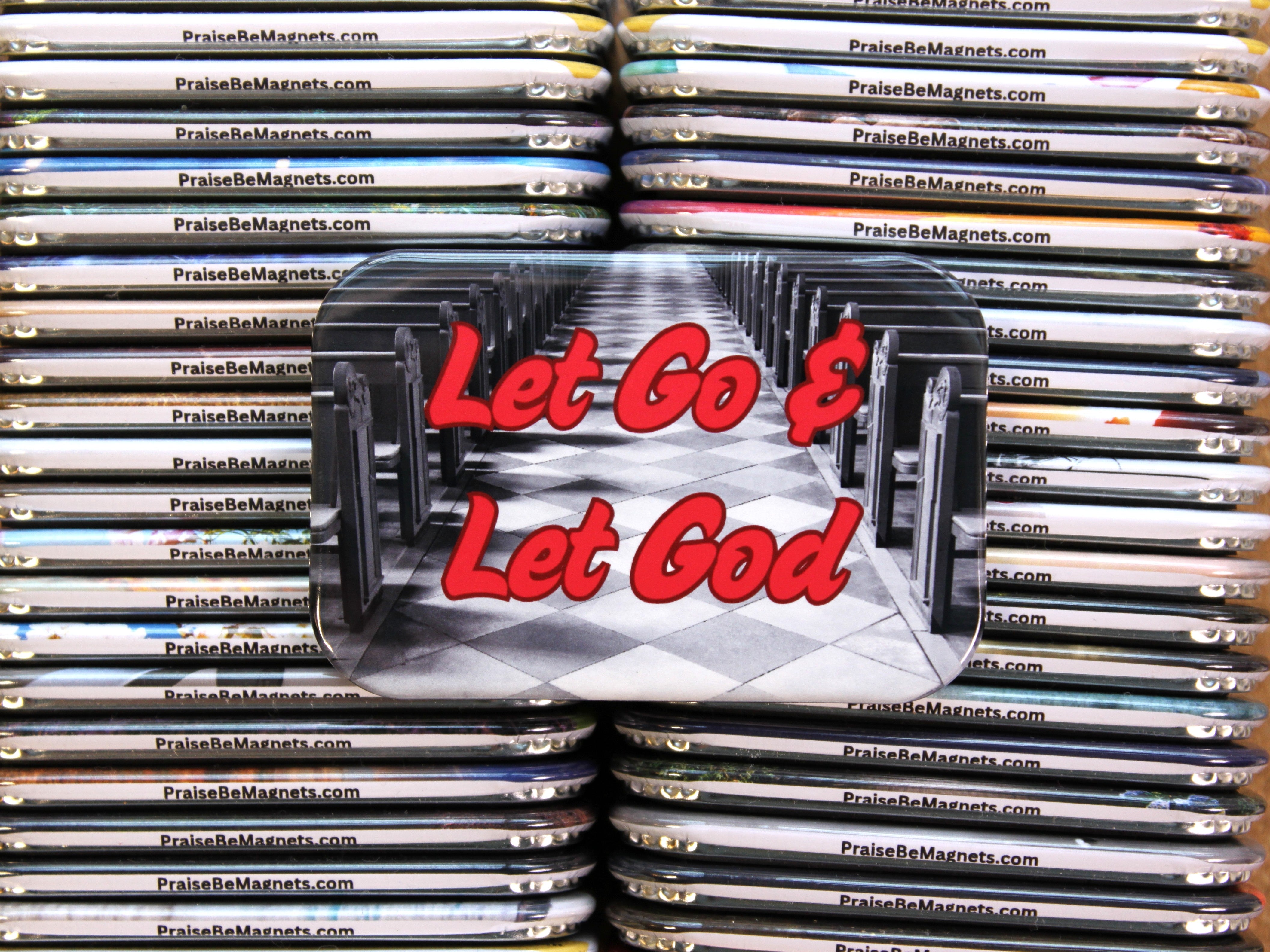 Stack of 'Let Go & Let God' magnets with visible branding.