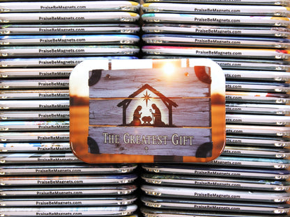 Stack of 'PraiseBeMagnets' with a nativity scene magnet on top