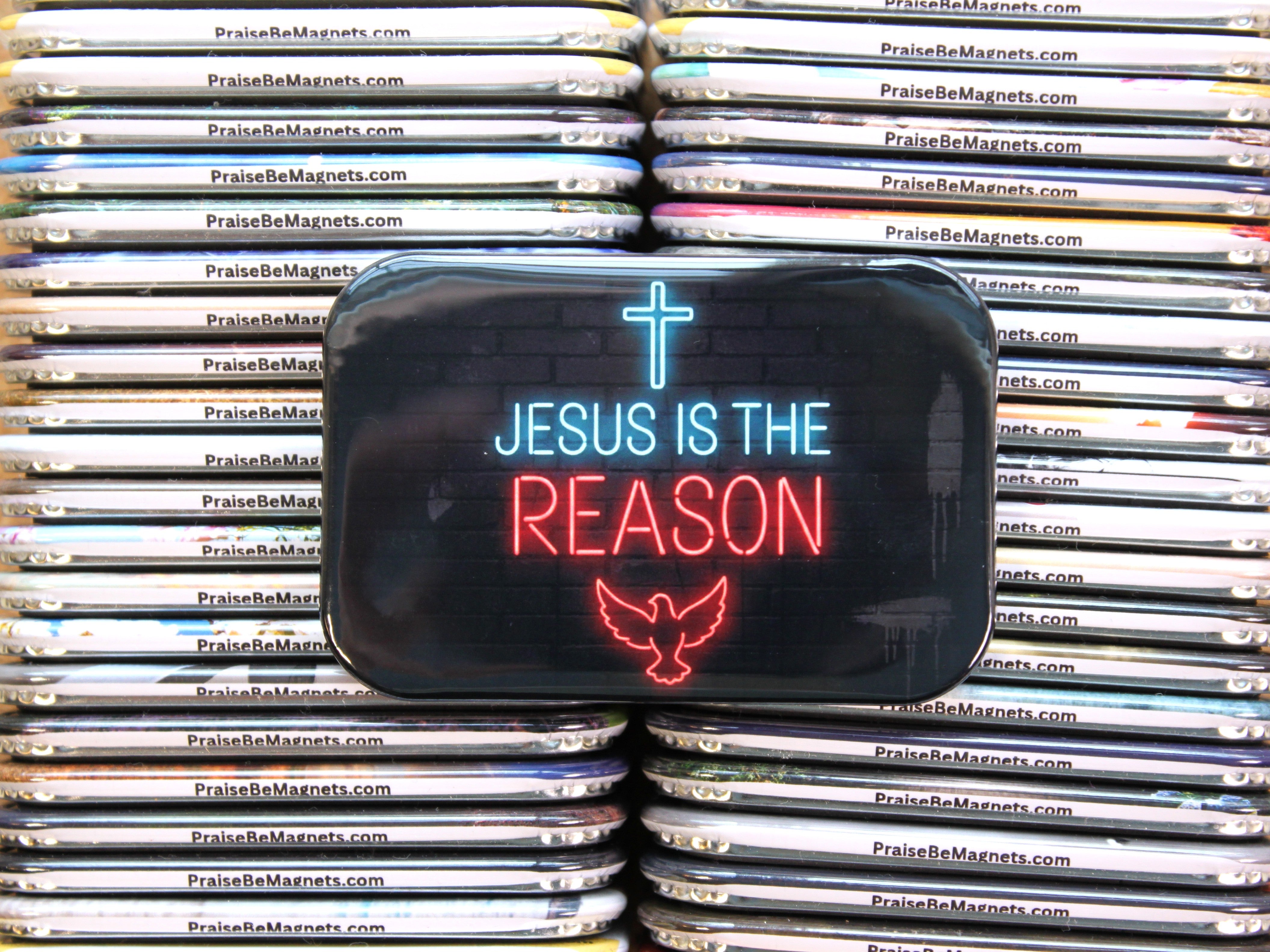 Stack of 'PraiseBeMagnets' products with a prominent 'Jesus is the Reason' sign.