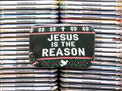 Stack of 'Praise Be Magnets' with a Christmas-themed pouch displaying 'Jesus is the Reason'.