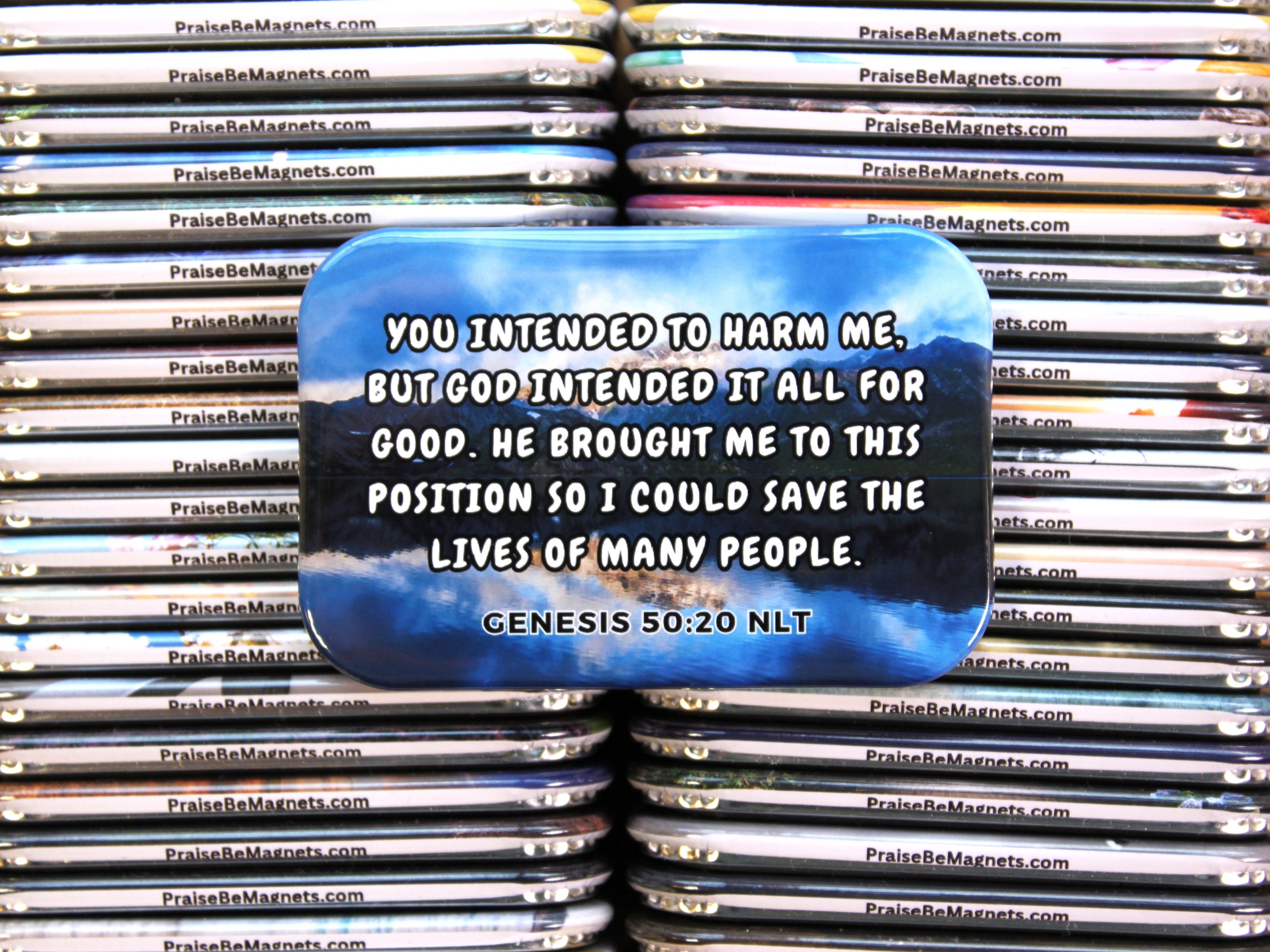 Stack of magnets with a motivational quote on a blue background, surrounded by other magnets.