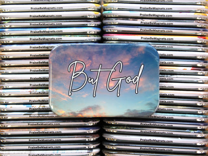 Stack of 'Praise Be Magnets' with a prominent magnet featuring 'But God' text.
